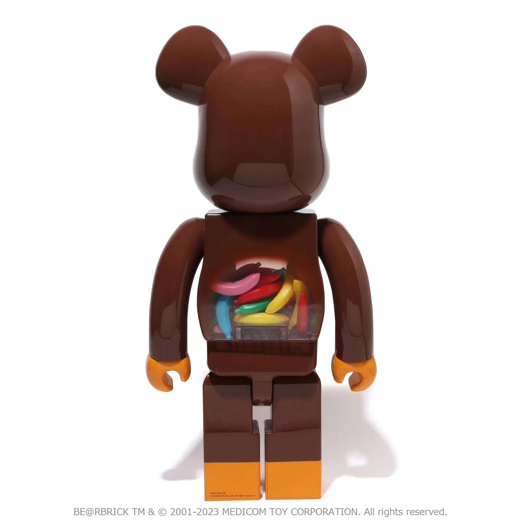 400% & 100% Bearbrick set - Baby Milo and Banana by BAPE showing brown figure with colorful banana design.